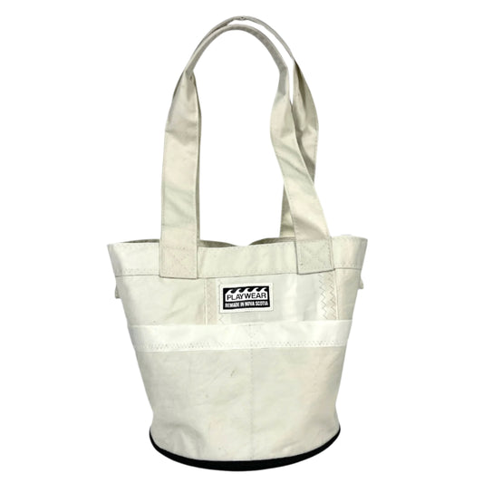 SUSTAINABLY MADE IN CANADA. UPCYCLED BY PLAYWEAR FROM REPURPOSED SAILS. ROUND DITTY-BAG, BUCKET STYLE TOTE WITH POCKETS. GREAT FOR THE BEACH.