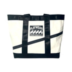 White tote bag with black straps and 'Playwear' logo on a white background