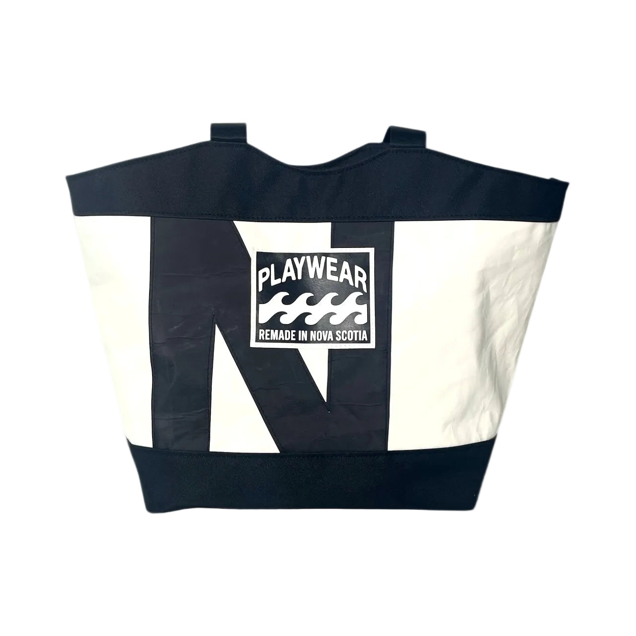 Tote bag with black and white design and 'Playwear Remade in Nova Scotia' logo on a white background