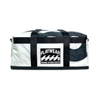 White duffel bag with black straps and 'Playwear Remade in Nova Scotia' logo on a white background