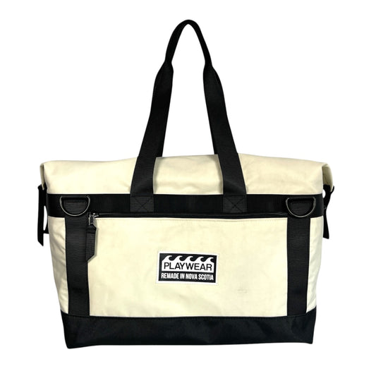 SUSTAINABLY MADE IN CANADA. UPCYCLED BY PLAYWEAR FROM REPURPOSED MARINE WASTE. DUFFEL/TOTE HYBRID CARRY-ON FOR TRAVEL.