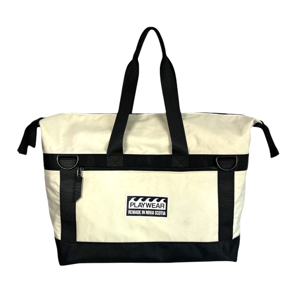 SUSTAINABLY MADE IN CANADA. UPCYCLED BY PLAYWEAR FROM REPURPOSED MARINE WASTE. DUFFEL/TOTE HYBRID CARRY-ON FOR TRAVEL.
