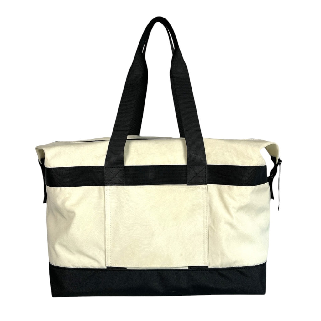 SUSTAINABLY MADE IN CANADA. UPCYCLED BY PLAYWEAR FROM REPURPOSED MARINE WASTE. DUFFEL/TOTE HYBRID CARRY-ON FOR TRAVEL.
